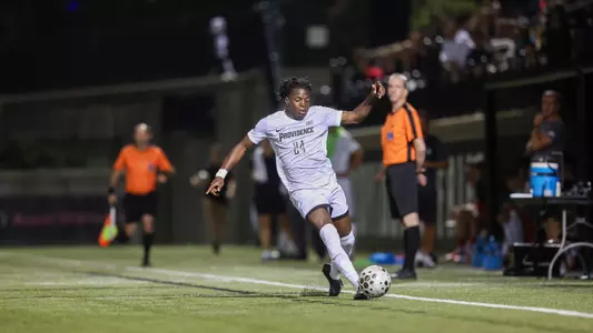 Mayowa Ajayi dribbles the ball down the sideline against Harvard on Chapey field at Anderson Stadium.