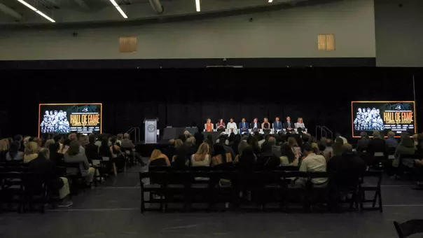 A wide shot of all the inductees in the 2026 Providence College Hall of Fame during a question and answer