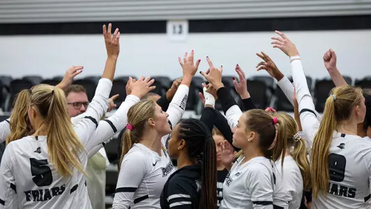 Team Huddle with hands up