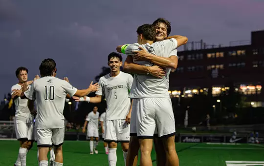 Team celebrating goal against LIU