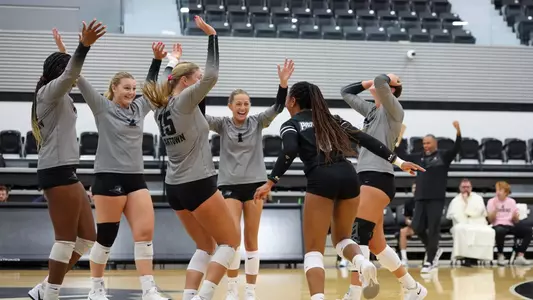 Volleyball celebrating a point at home during Rhode Island classic