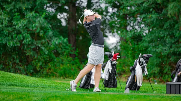 Men's golf player Oliver Clark hitting a tee shot