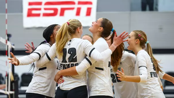 Volleyball Celebrating a point against Manhattan