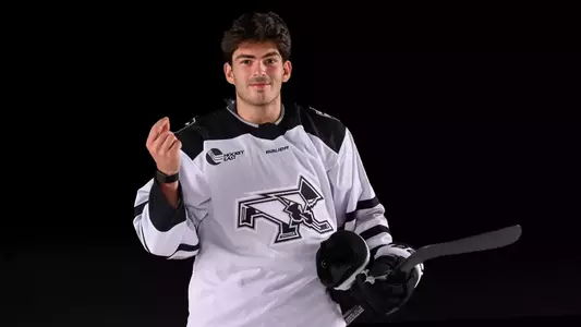 JJ Monteiro Men's Hockey money celebration