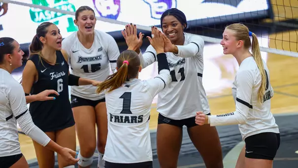 Lyric Berry and Miller McDonald High Five celebration against Manhattan