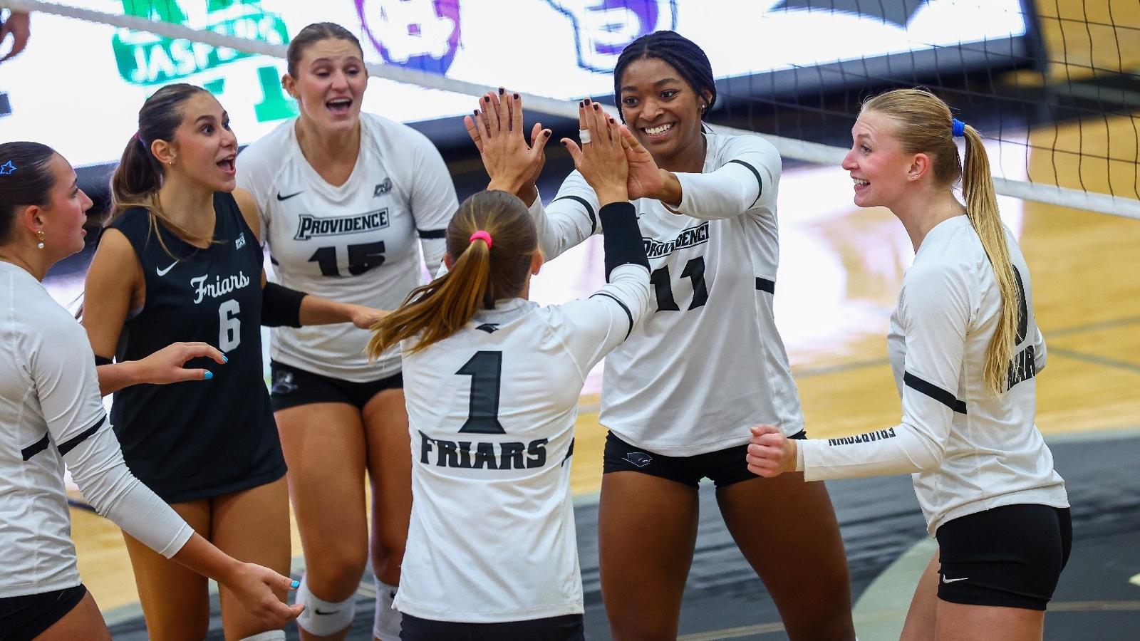 Photo: friars.com Lyric Berry and Miller McDonald High Five celebration against Manhattan