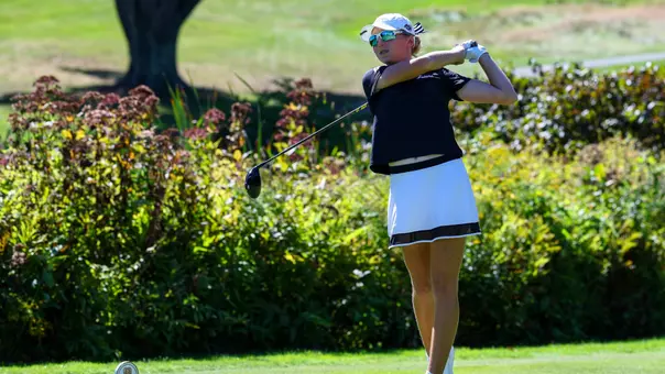 Women's golf player Bailey Baio hitting a drive