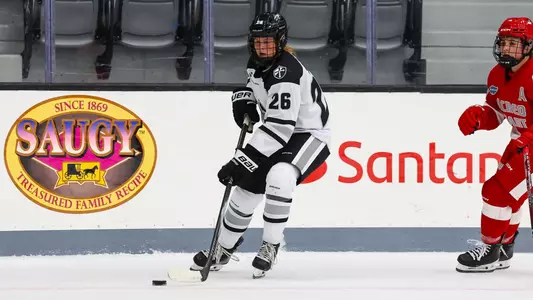 Cameryn Shiels controlling the puck against Sacred Heart