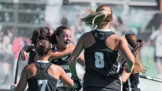 Field Hockey Team Celebrates after scoring a goal