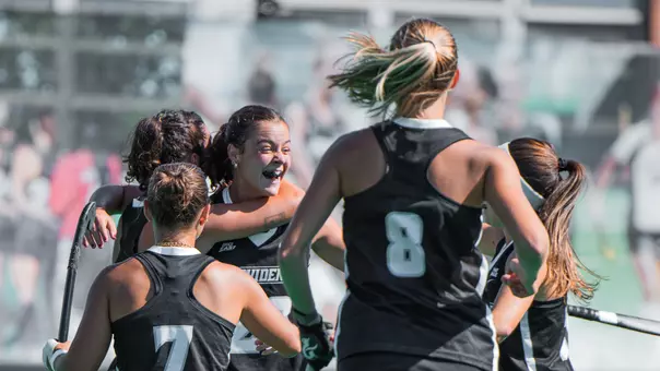 Field Hockey Team Celebrates after scoring a goal