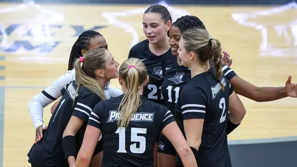 Providence Volleyball celebrating point against new haven