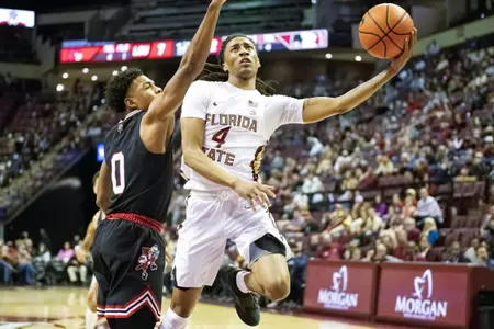 M. Basketball Defeats Louisville 79-70