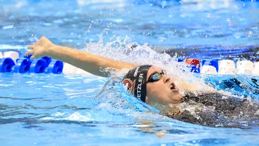 Metzler Wraps Up Career, Huggins Contributes Personal Best