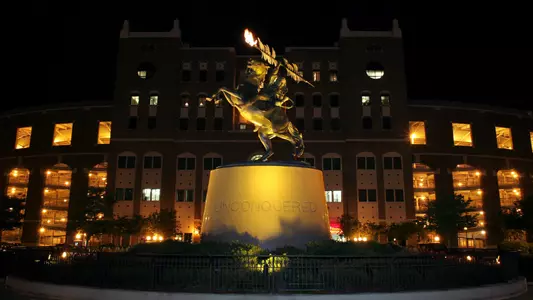 Candlelight Vigil for Virginia Tech on Landis Green and the Unconquered Statue.
