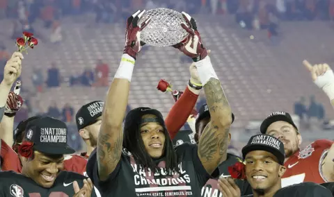 Kelvin-Benjamin-hoists-trophy-scaled
