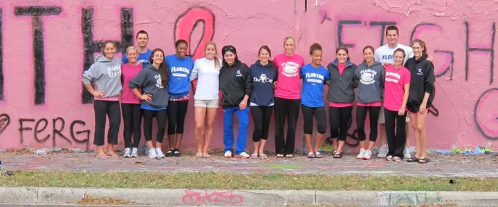 Gator Gymnasts Help Turn 34th Street Wall Pink for Upcoming Making Strides Against Breast Cancer
