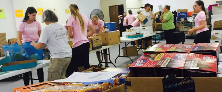 Florida Softball Team Volunteers with Food4Kids Backpack Program