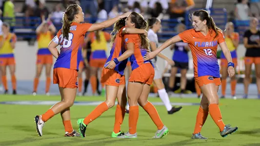 Samantha Chung (#2 middle) is hugged after her first collegiate goal - vs UCF 9-18-16