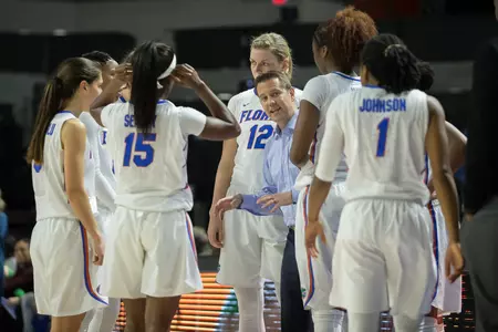 Cameron Newbauer, group huddle