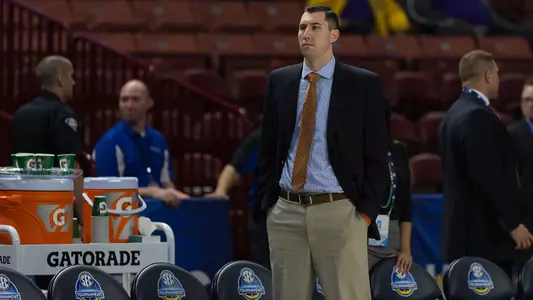 Ryan Gensler video coordinator standing on court