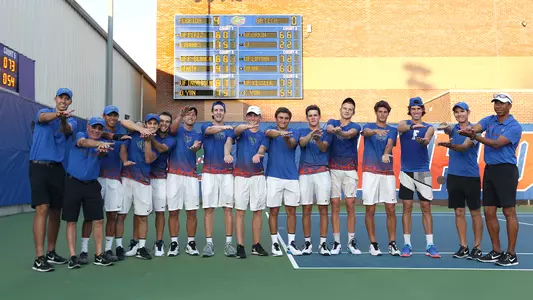 Men's tennis team chomp