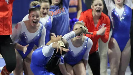 The Gators cheer Kennedy Baker during her floor exercise routine versus Alabama 2-9-18