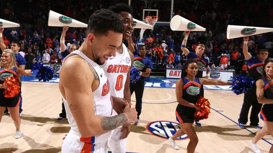 Chris Chiozza, Mike Okauru