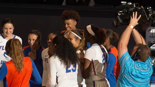 Video camera focus on team huddle -
