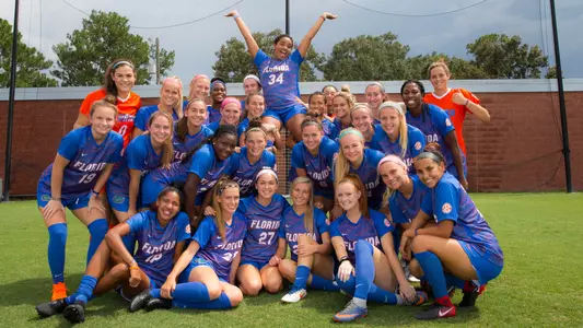 Lauren Evans celebrates her success fight versus cancer with Gator teammates