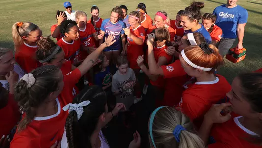 Team huddle with Brooke Dunn in center - vs UCF 9-8-19