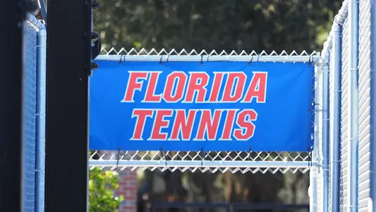 Blue Florida Tennis sign outside chainlink fence