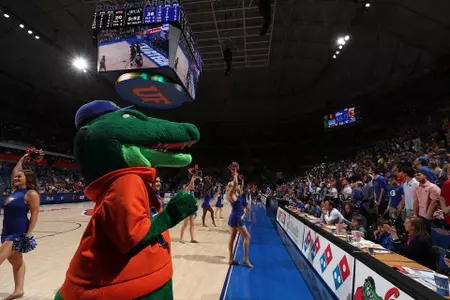 Albert cheering with fans at Men's Basketball 2020
