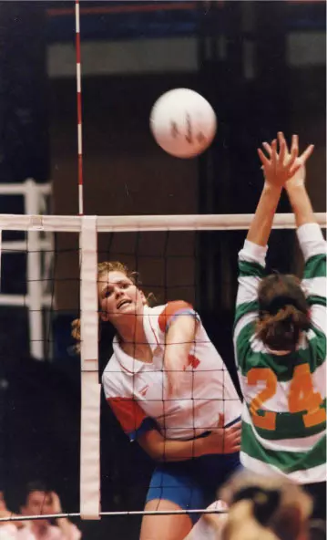 Jenny Wood (94) playing volleyball