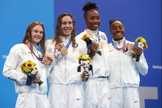 TOKYO, JAPAN - JULY 25: (L-R) Erika Brown, Abbey Weitzeil, Natalie Hinds and Simone Manuel of Team United States pose with the bronze medal for the Women's 4 x 100m Freestyle Relay Final on day two of the Tokyo 2020 Olympic Games at Tokyo Aquatics Centre on July 25, 2021 in Tokyo, Japan. (Photo by Clive Rose/Getty Images)