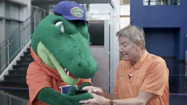 Albert gets help with his mobile tickets from Coach Spurrier