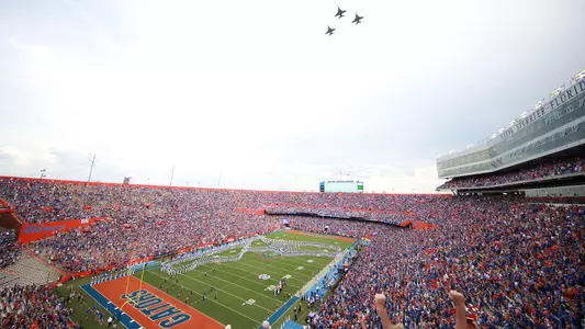 Three jets flyover Ben Hill Griffin Stadium