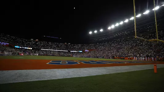 The Swamp at night with fans holding lights