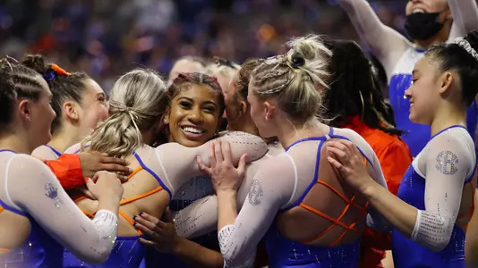 Nya Reed is congratulated after her 10.0 floor routine versus LSU 220211