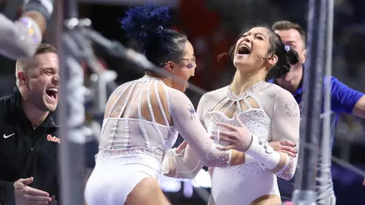 NguyenVictoria (right) and HurdMorgan celebrate uneven bars - 230106