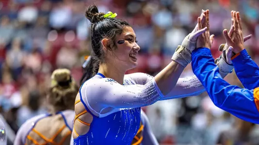 Kayla DiCello high-fives teammate at Alabama 230120