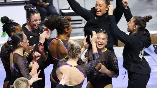Ellie Lazzari celebrates her 9.975 balance beam routine with the Gators 240112