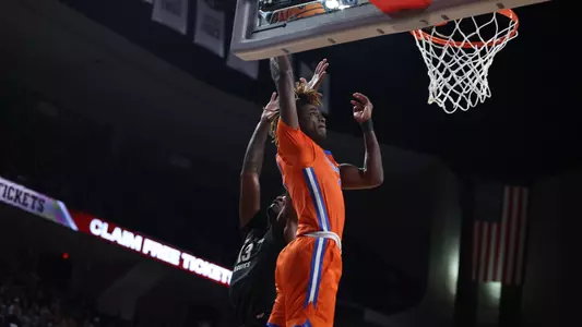 Denzel Aberdeen finishes an alley-oop during the Gators' game against the Texas A&M Aggies  on Saturday, February 3, 2024 at Reed Arena in College Station, TX / UAA Communications photo by Maddie Washburn