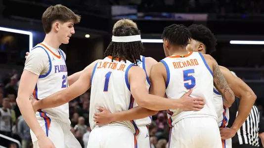Players huddle during the Gators' game against the Colorado Buffaloes in the first round of the NCAA Tournament on Friday, March 22, 2024 at Gainbridge Fieldhouse in Indianapolis, IN / UAA Communications photo by Maddie Washburn