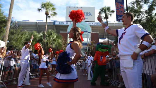 Gator Cheerleaders cheer on Gator Walk in front of Ben Hill Griffin Stadium