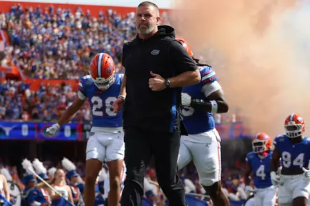 Gators head coach Billy Napier runs onto the field before the win over Texas.
