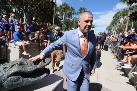 Gators head coach Billy Napier rubs the gator head for good luck prior to the Mississippi State game on UF homecoming.