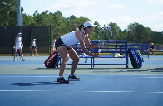 Nong playing doubles at ITA Southeast Regionals