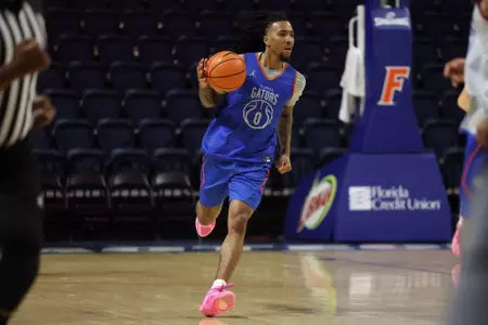 Boogie Fland brings the ball up the floor in a preseason scrimmage.