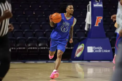 Boogie Fland brings the ball up the floor in a preseason scrimmage.