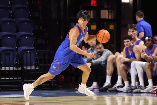 Xaivian Lee dribbles up the floor in a scrimmage at the O'Connell Center.